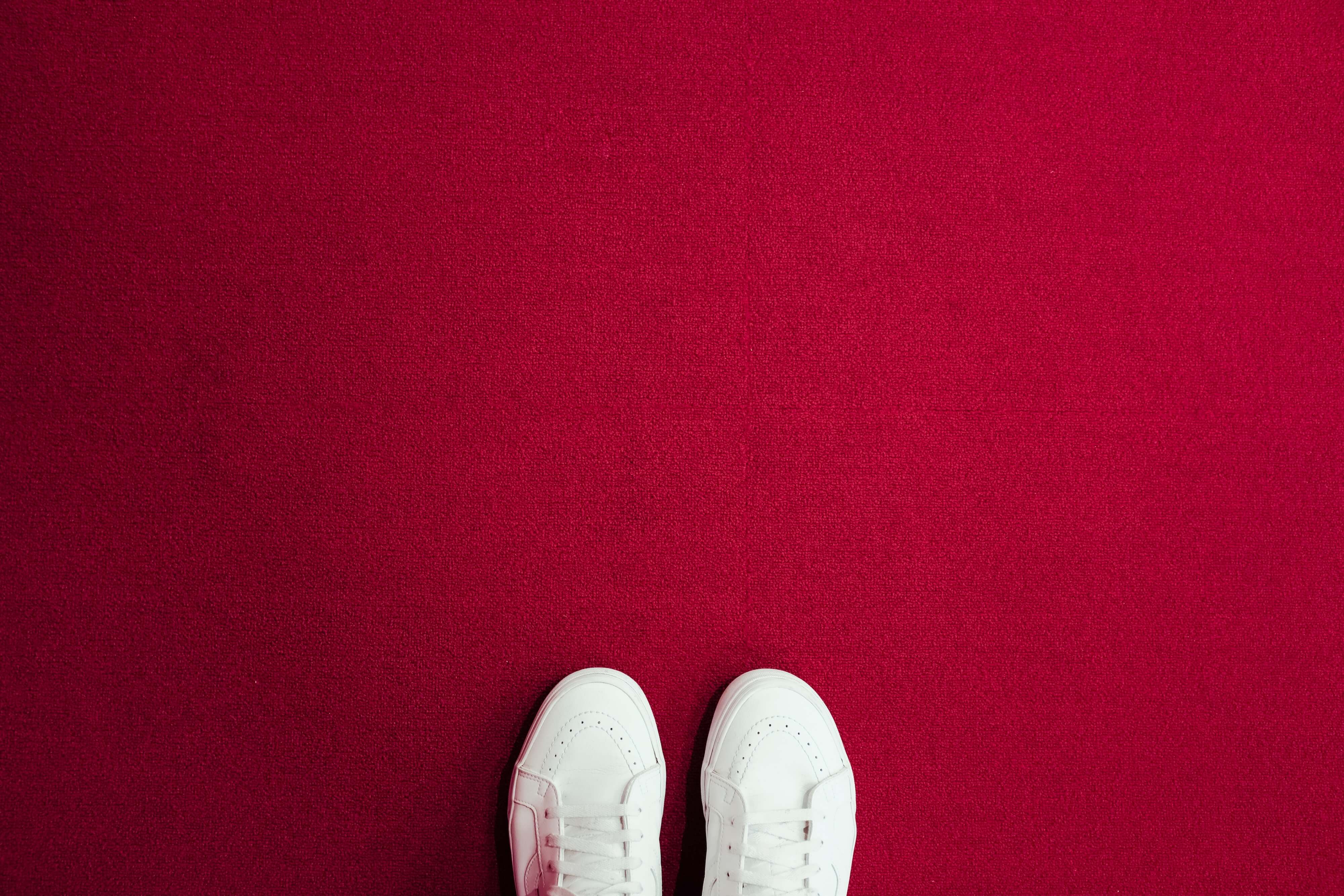white shoes on red carpet