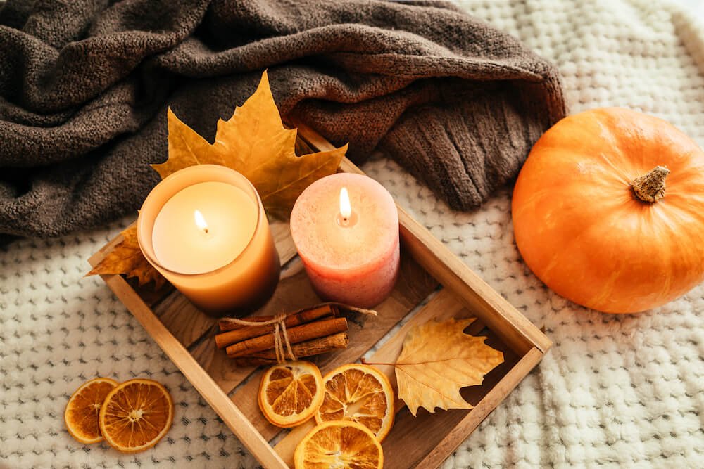 fall decorations, a pumpkin and two small candles